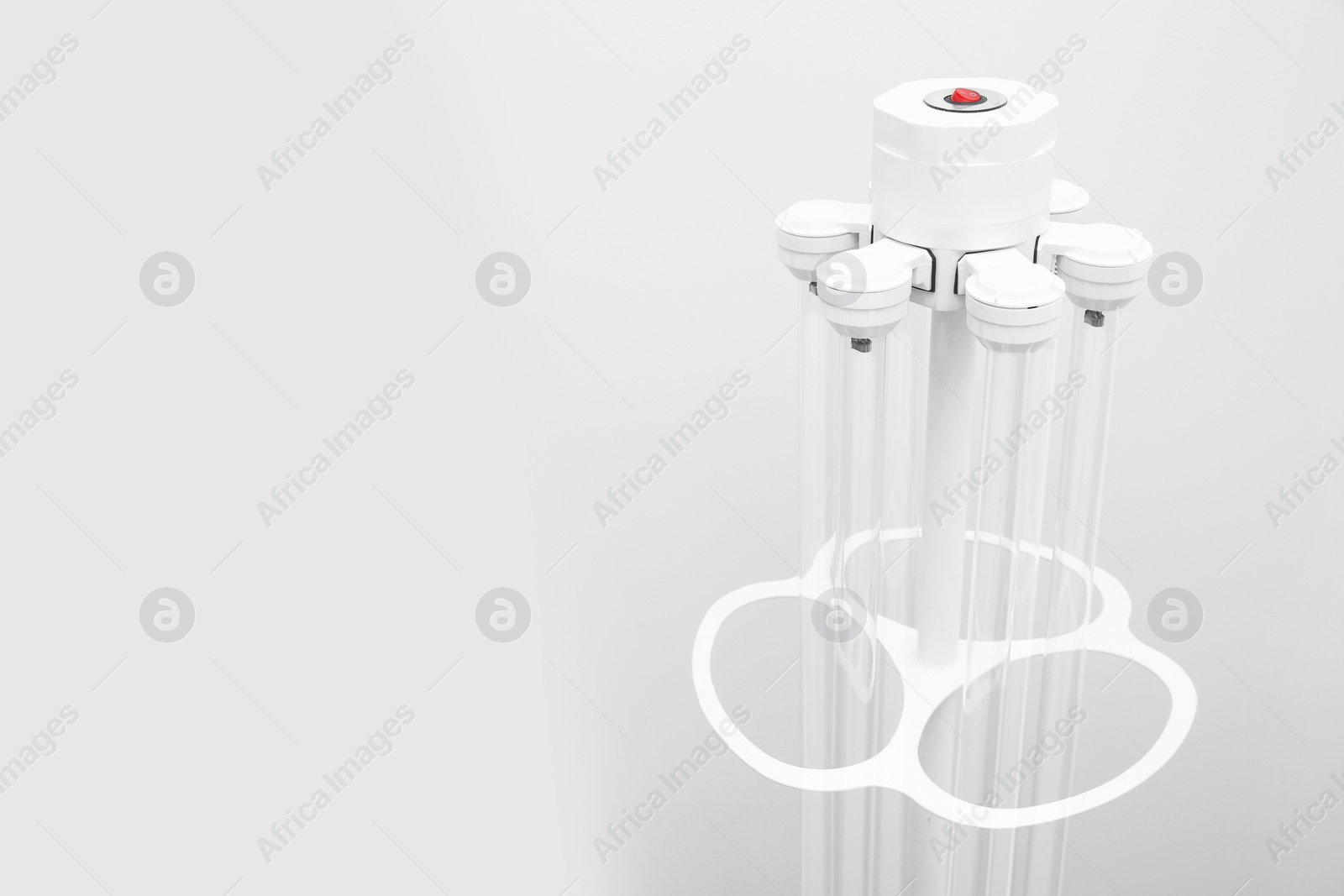 Photo of Hospital UV disinfection quartz lamps on light background, space for text