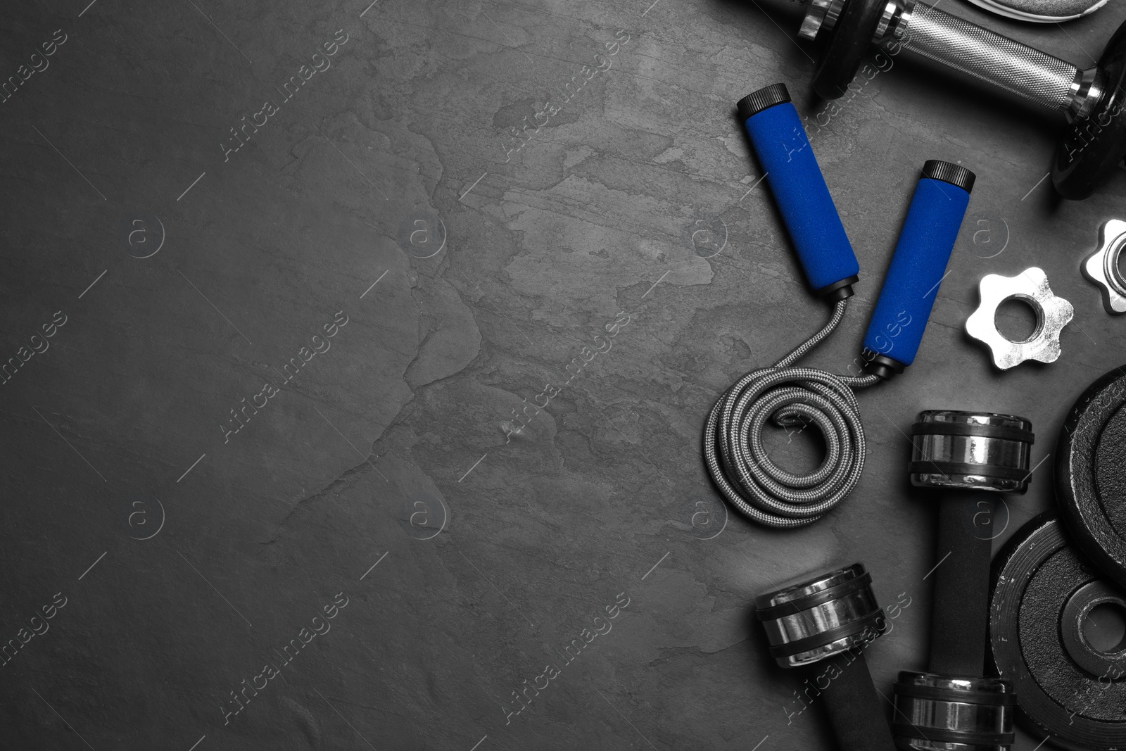 Gym equipment on black background, flat lay. Space for text Photo of Gym equipment on black background, flat lay. Space for text