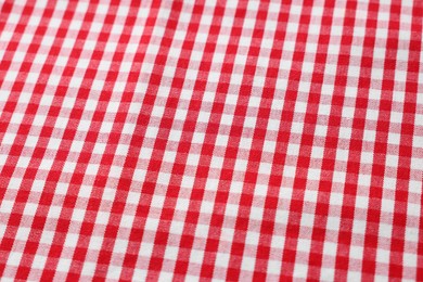 Red checkered tablecloth as background, closeup view
