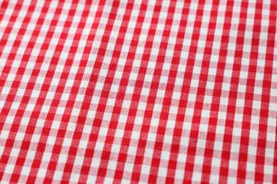 Photo of Red checkered tablecloth as background, closeup view