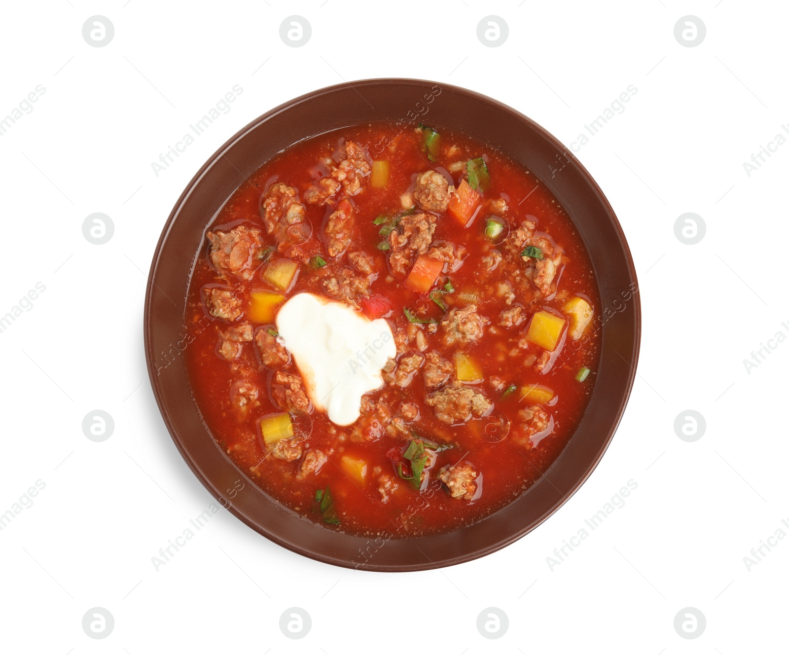 Photo of Bowl of delicious stuffed pepper soup on white background, top view