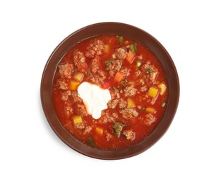 Photo of Bowl of delicious stuffed pepper soup on white background, top view