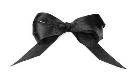 Photo of Elegant black ribbon tied in bow isolated on white, top view
