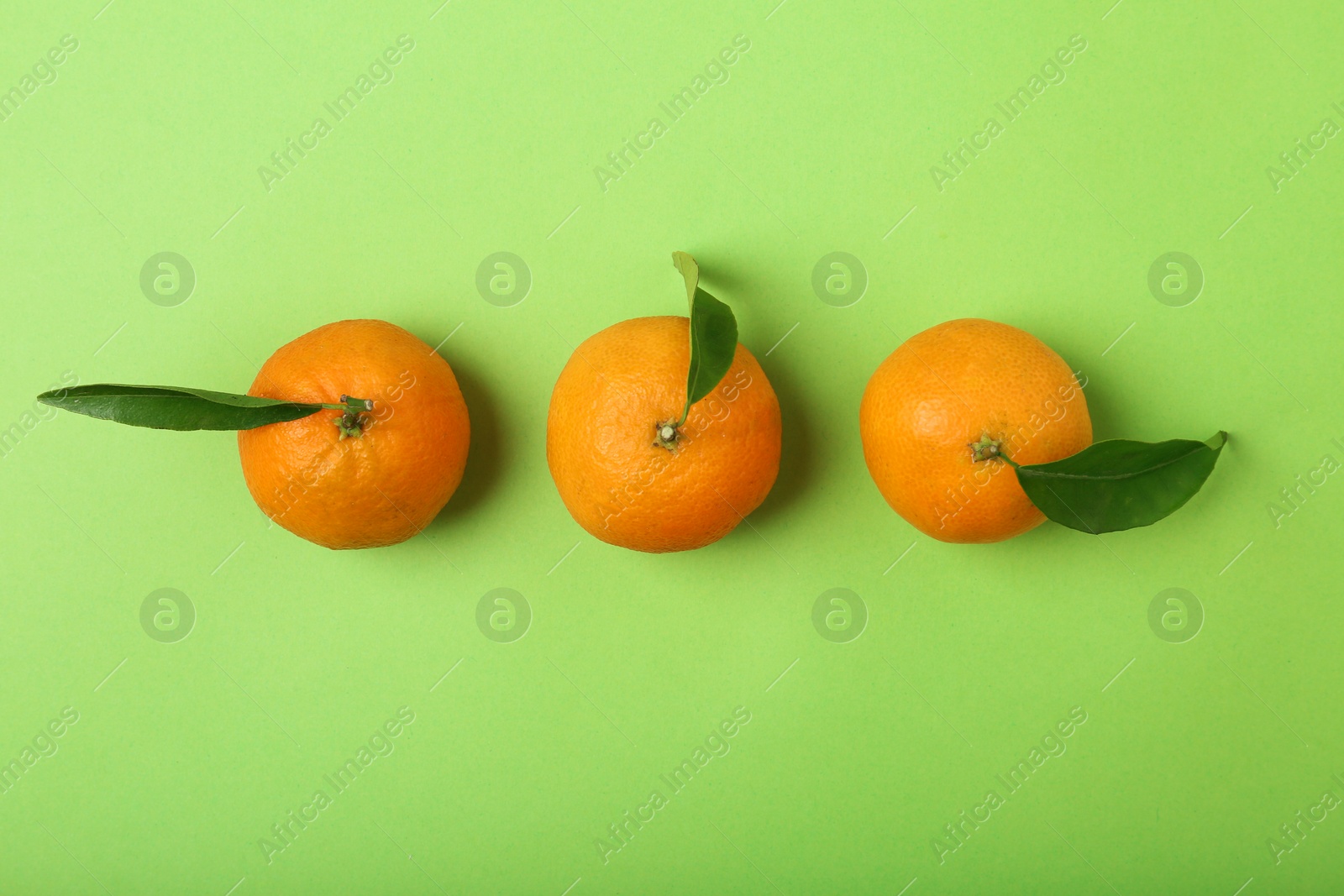 Photo of Composition with tangerines on color background, flat lay