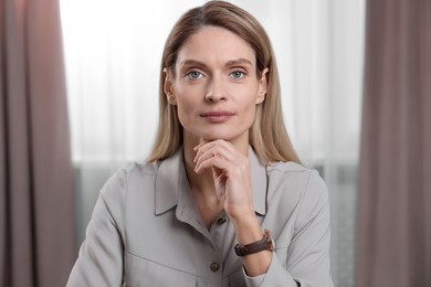 Photo of Woman having video call indoors, view from web camera