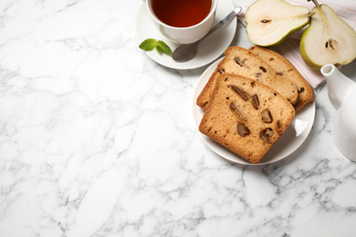 Photo of Flat lay composition with pear bread on white marble table, space for text. Homemade cake