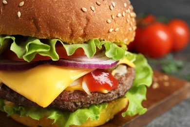 Delicious burger with beef patty and lettuce on table, closeup