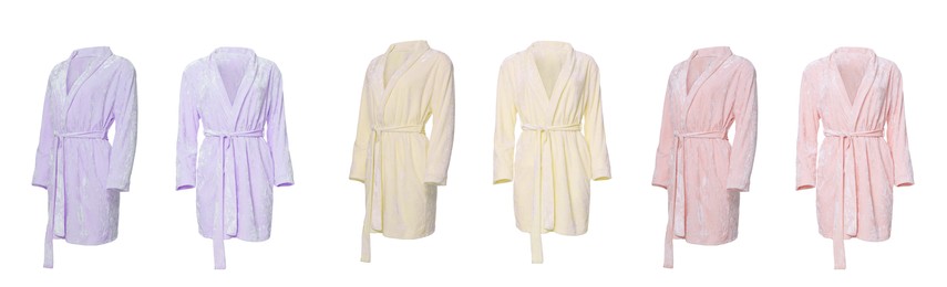 Image of Set of different color velour bathrobes on white background