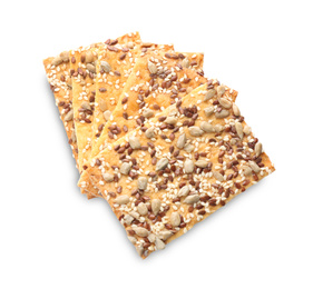 Photo of Stack of delicious crispy crackers with sunflower, flax and sesame seeds on white background, top view