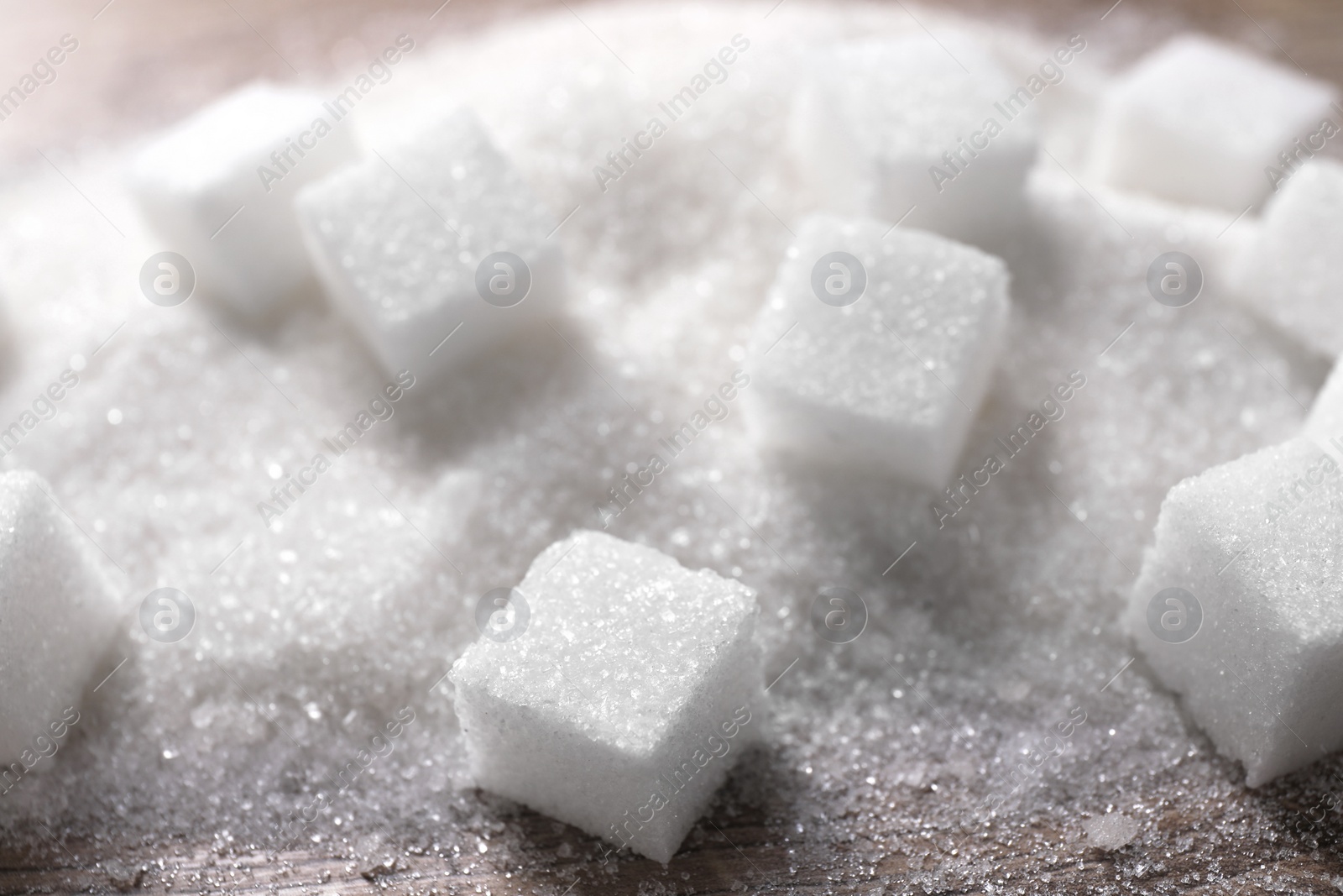 Photo of Different types of white sugar on table, closeup