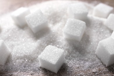 Different types of white sugar on table, closeup