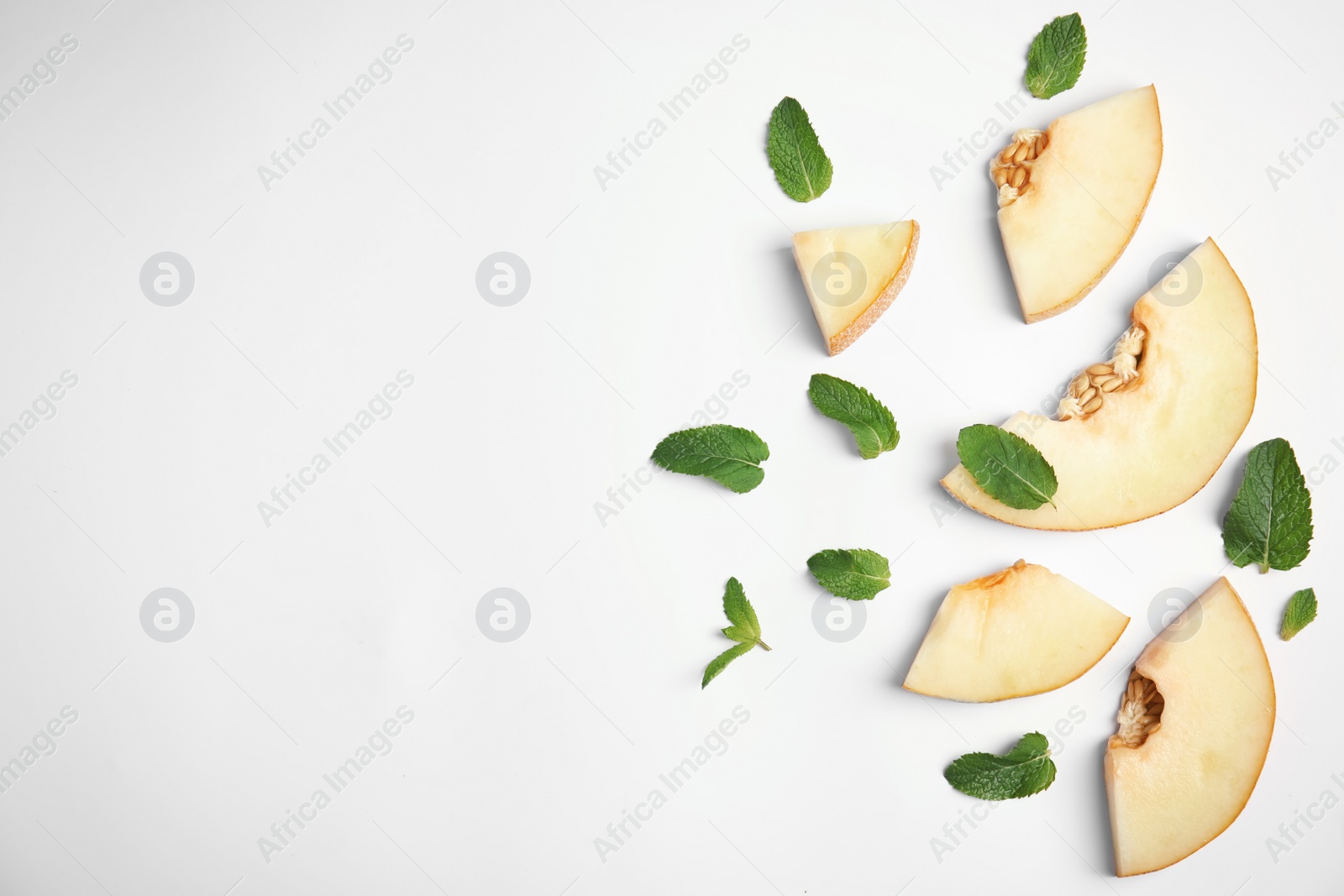 Photo of Flat lay composition with melon, mint leaves and space for text on white background