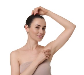 Photo of Beautiful woman showing armpit with smooth clean skin on white background