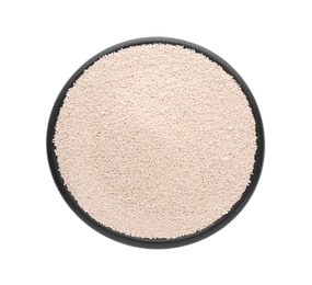 Bowl of active dry yeast isolated on white, top view