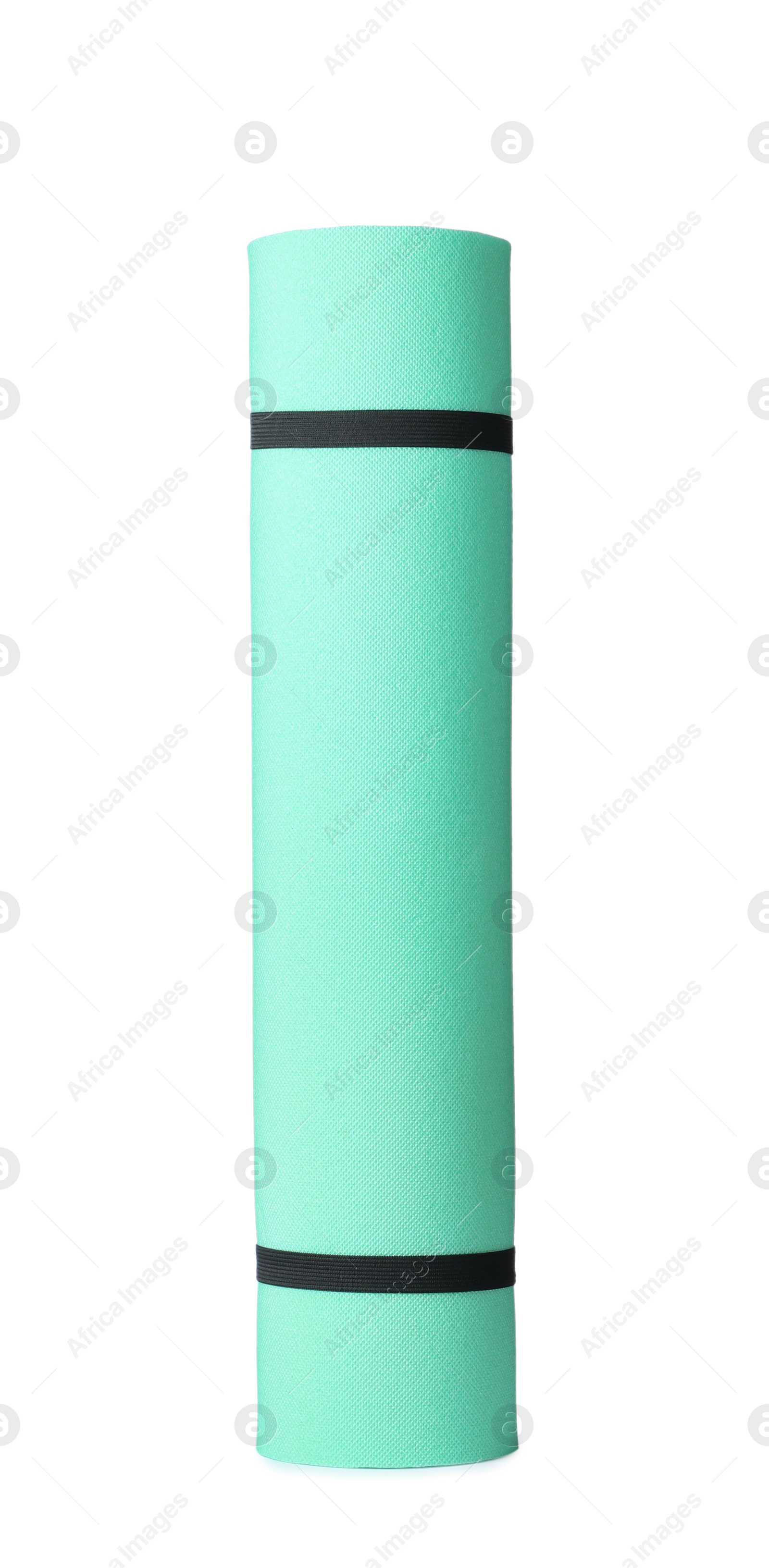 Photo of Rolled turquoise camping mat isolated on white