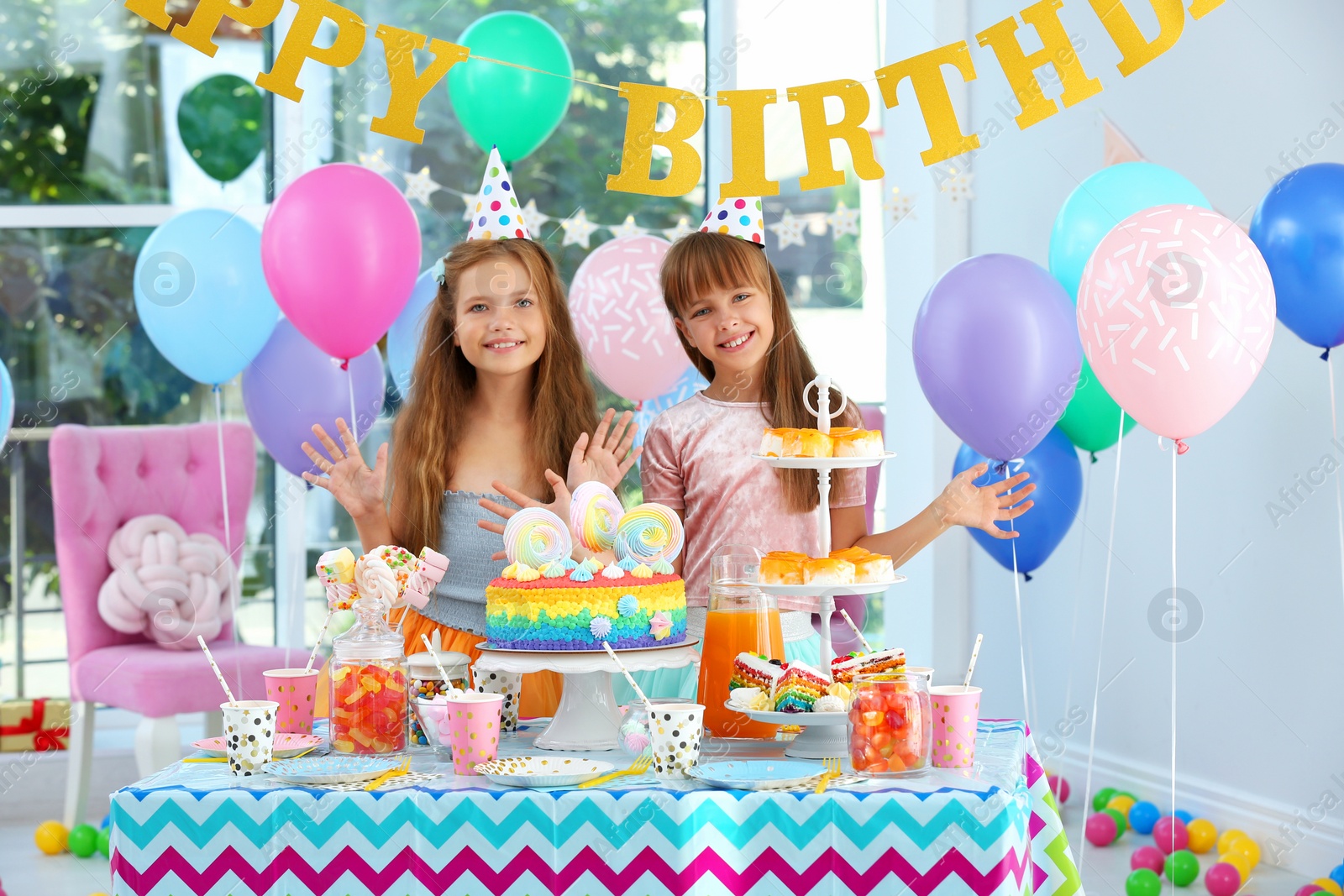 Photo of Happy children at birthday party in decorated room