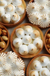 Many different tartlets on grey table, flat lay. Delicious dessert