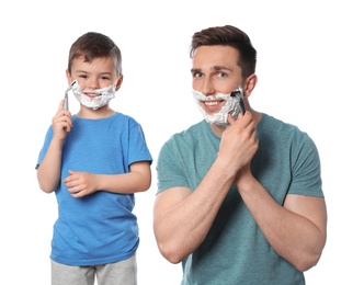 Photo of Dad shaving and son imitating him on white background