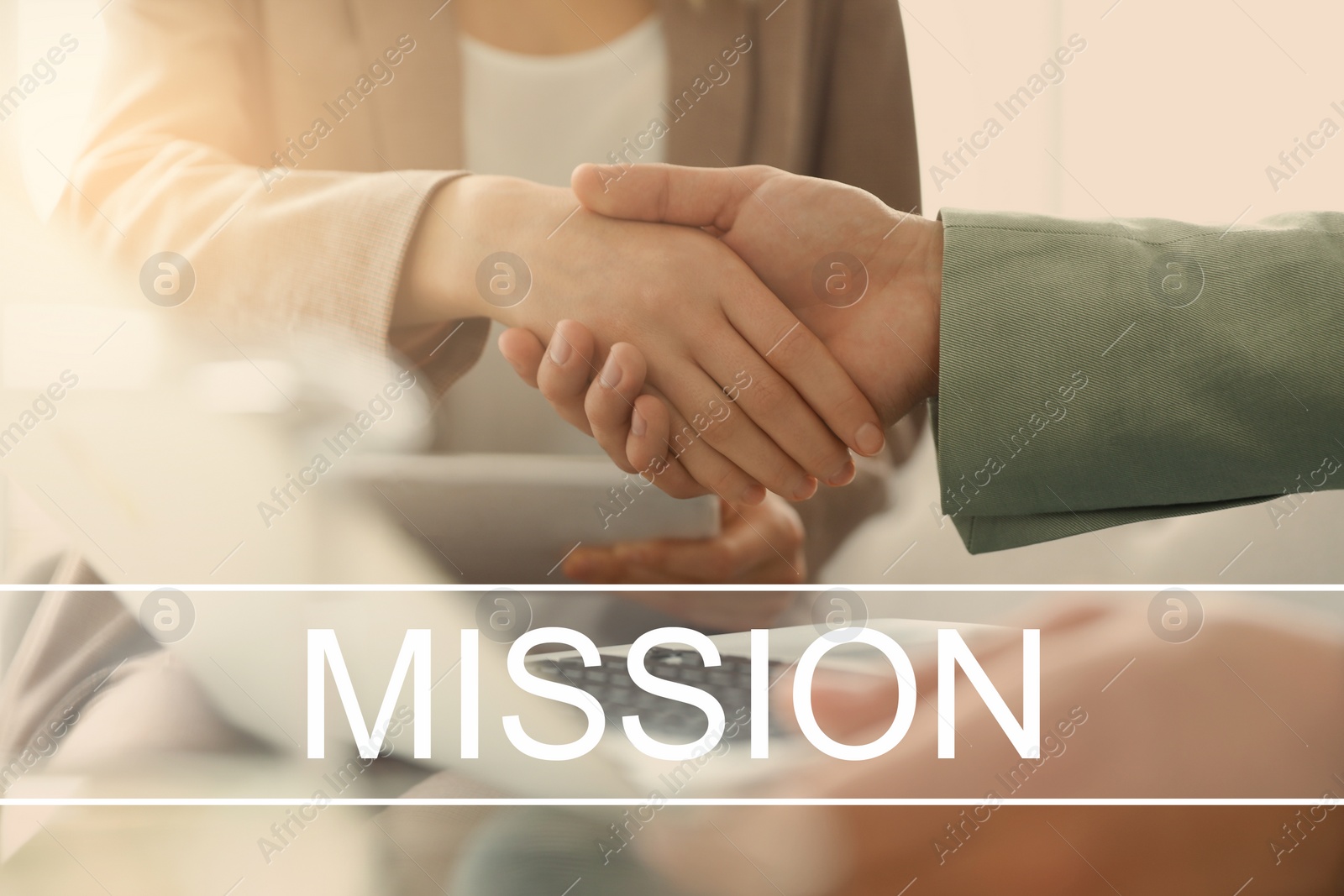 Image of People shaking hands and text MISSION, closeup