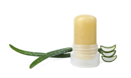 Natural crystal alum deodorant and fresh aloe on white background