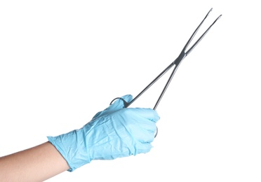 Photo of Doctor in sterile glove holding medical forceps on white background