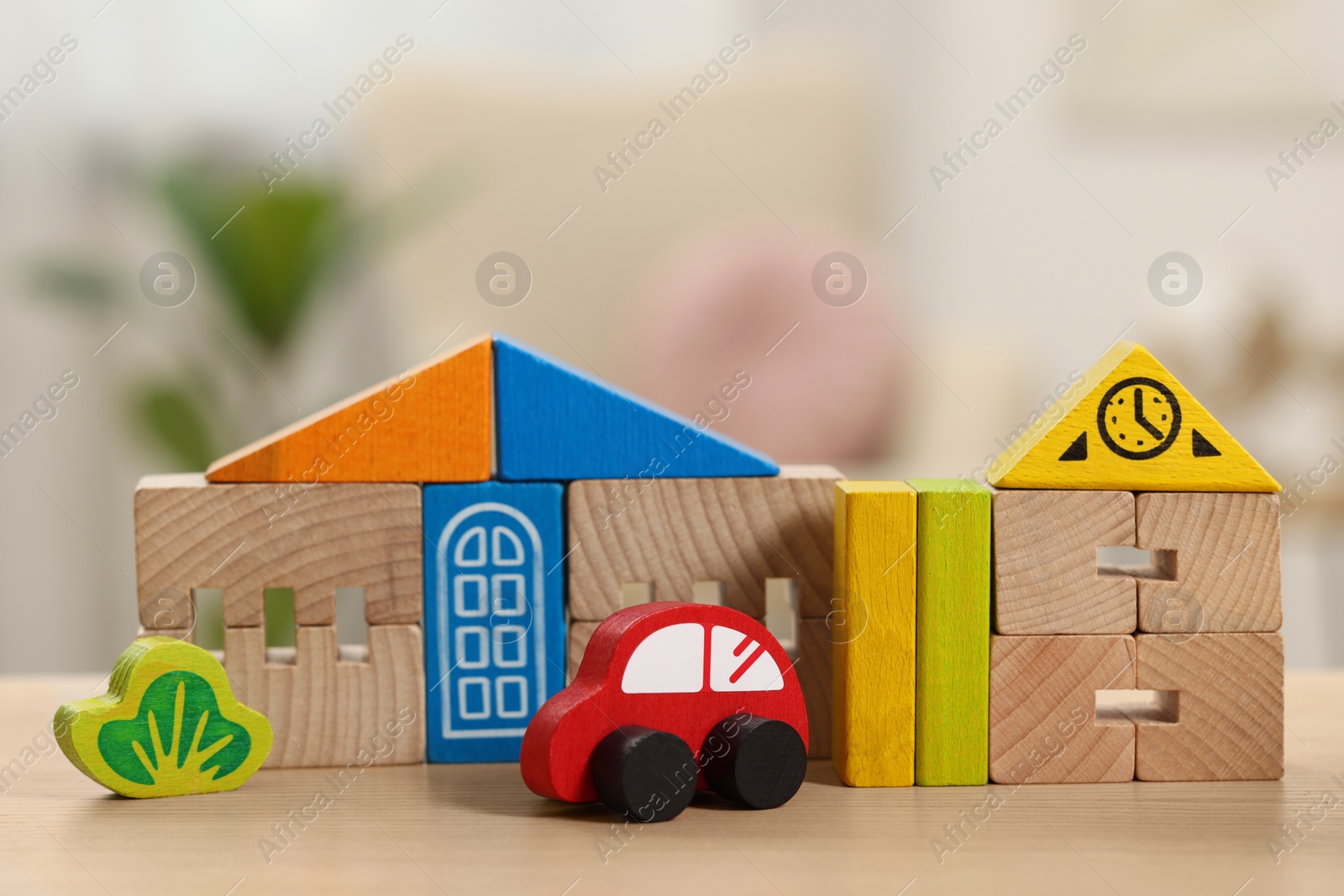 Photo of Set of wooden toys on table indoors, closeup. Children's development