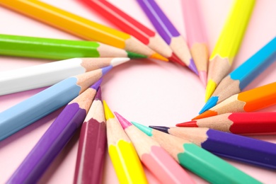 Photo of Composition with color pencils on pink background, closeup