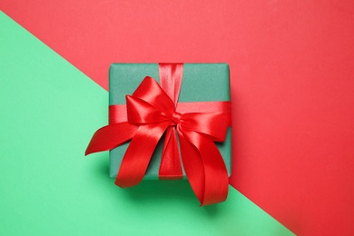Photo of Gift box on color background, top view