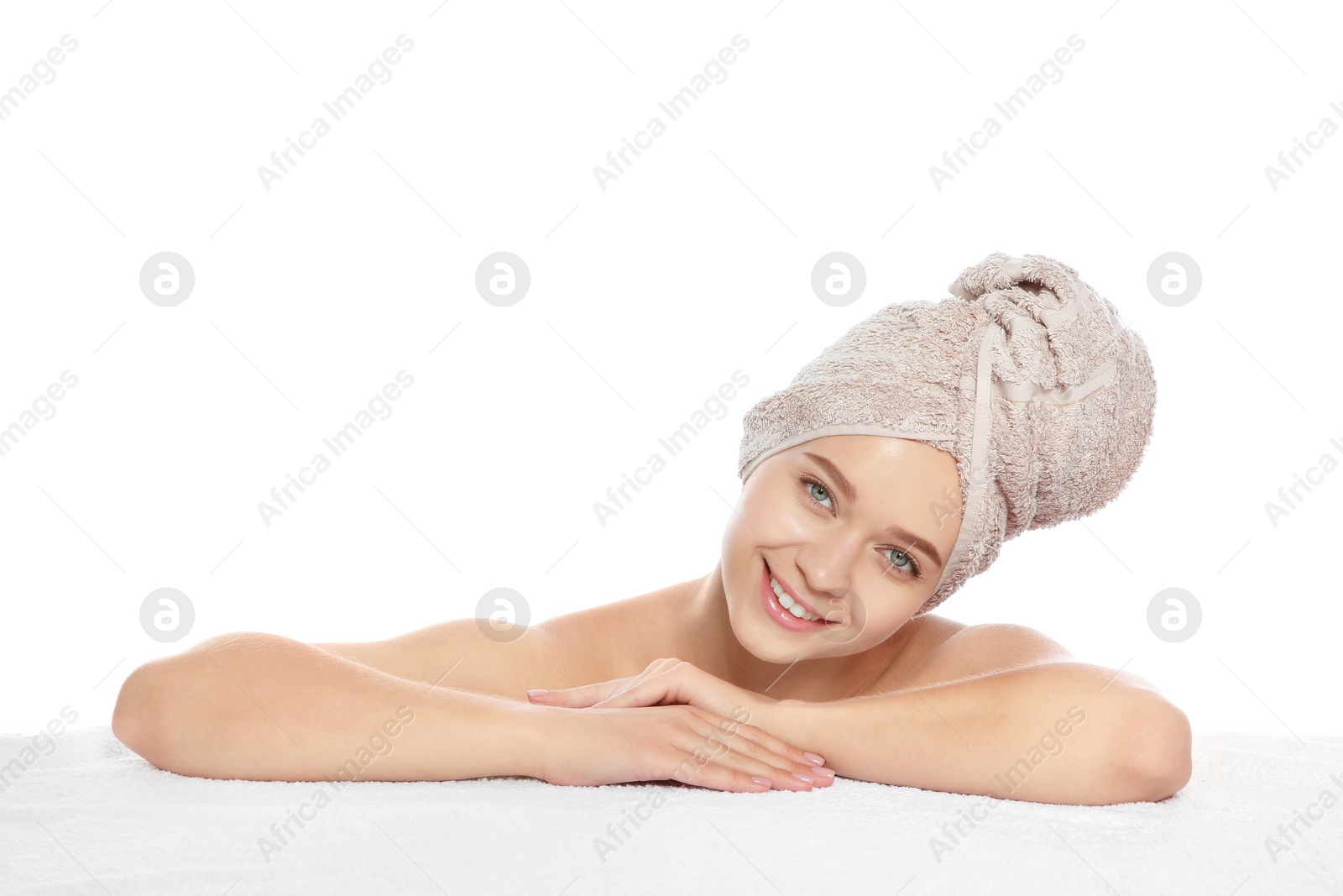 Photo of Portrait of young pretty woman with towel on white background