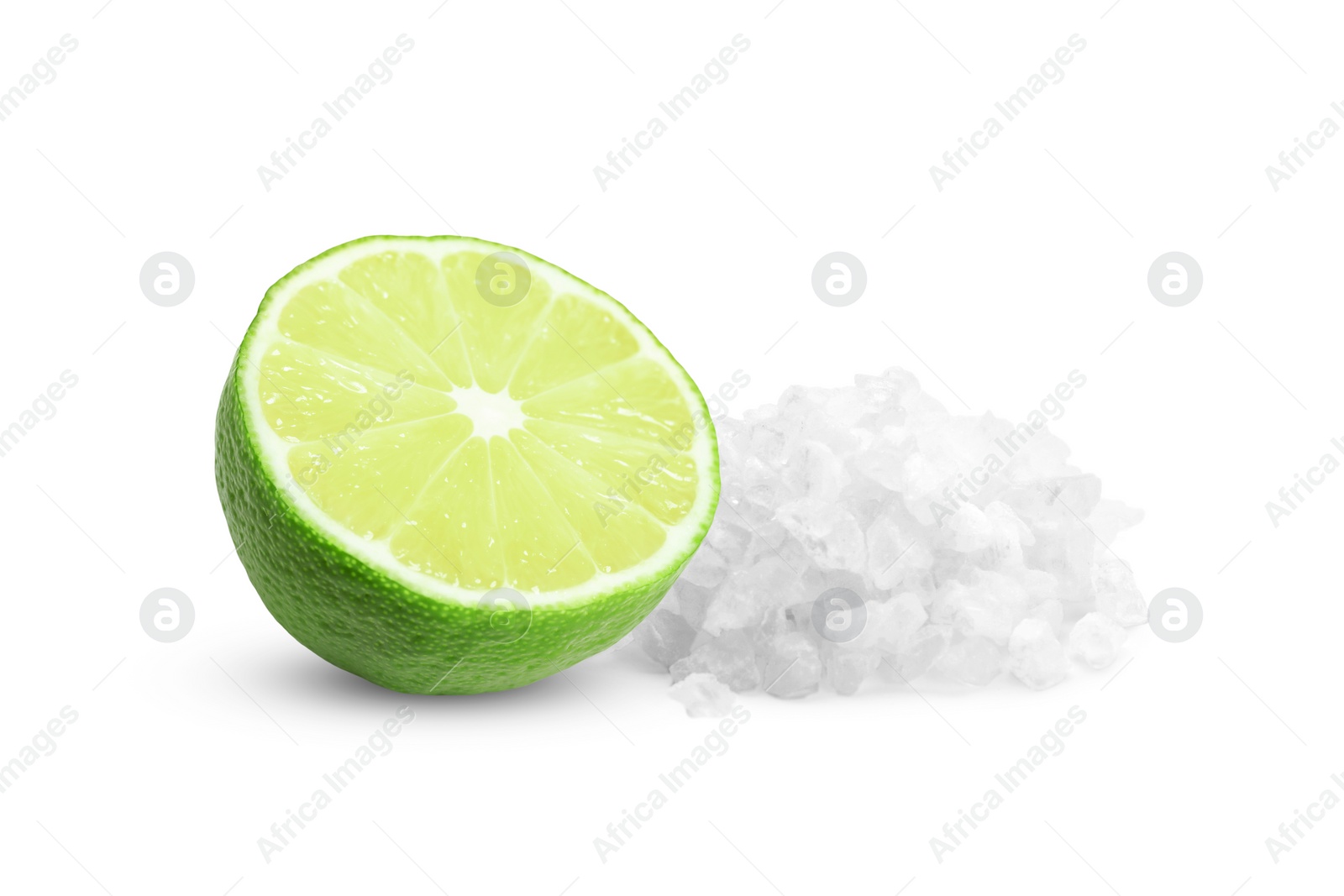 Image of Cut lime and salt isolated on white. Margarita cocktail ingredients