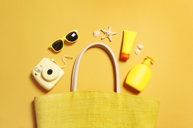 Flat lay composition with beach accessories on color background