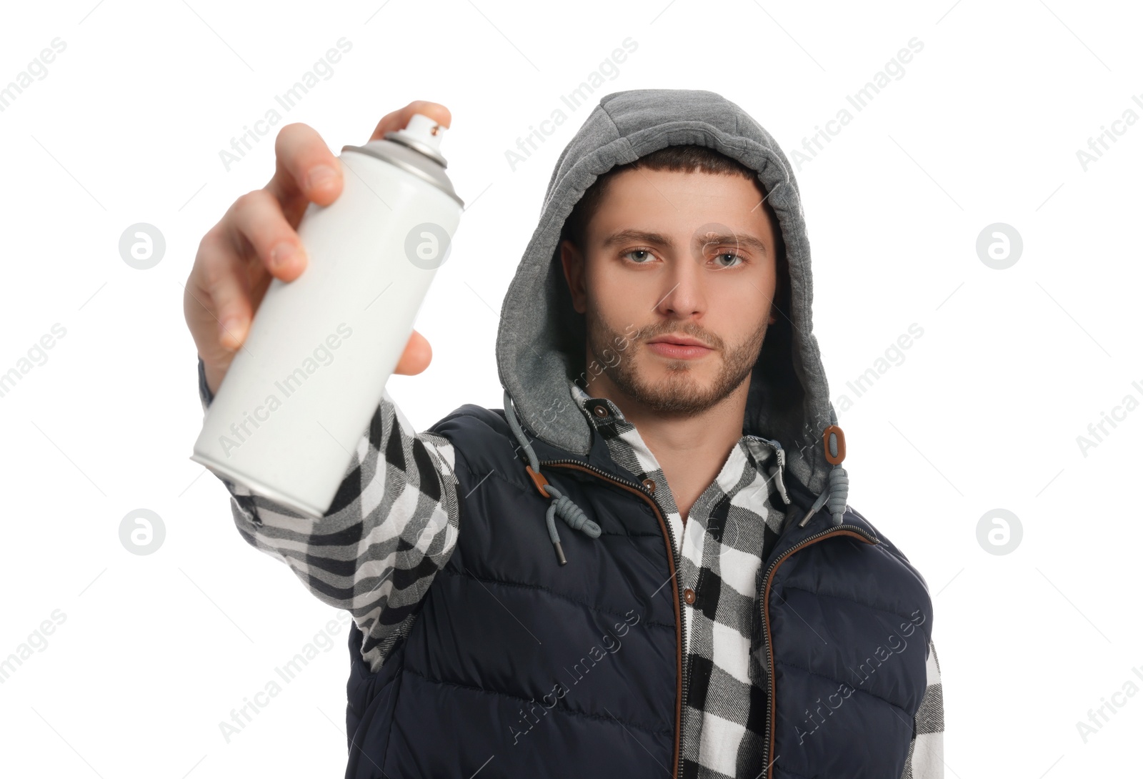 Photo of Handsome man holding can of spray paint on white background