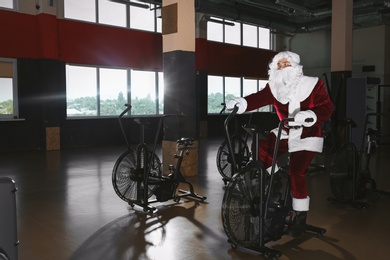 Young Santa Claus training in modern gym