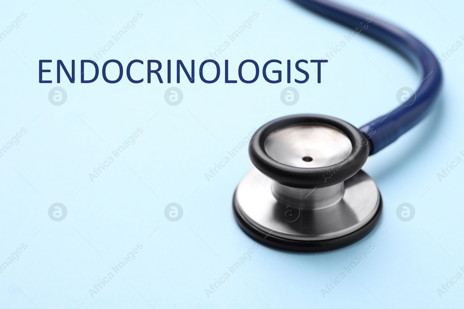 Image of Endocrinologist. Stethoscope on light blue background, closeup. Space for text