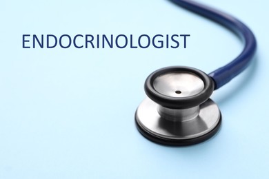 Image of Endocrinologist. Stethoscope on light blue background, closeup. Space for text