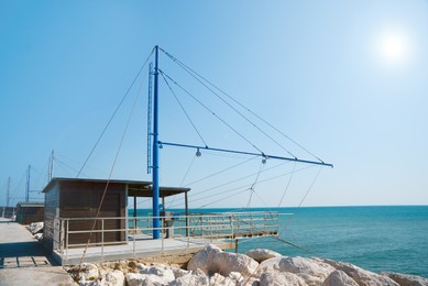 Photo of Shore operated stationary lift net on coast