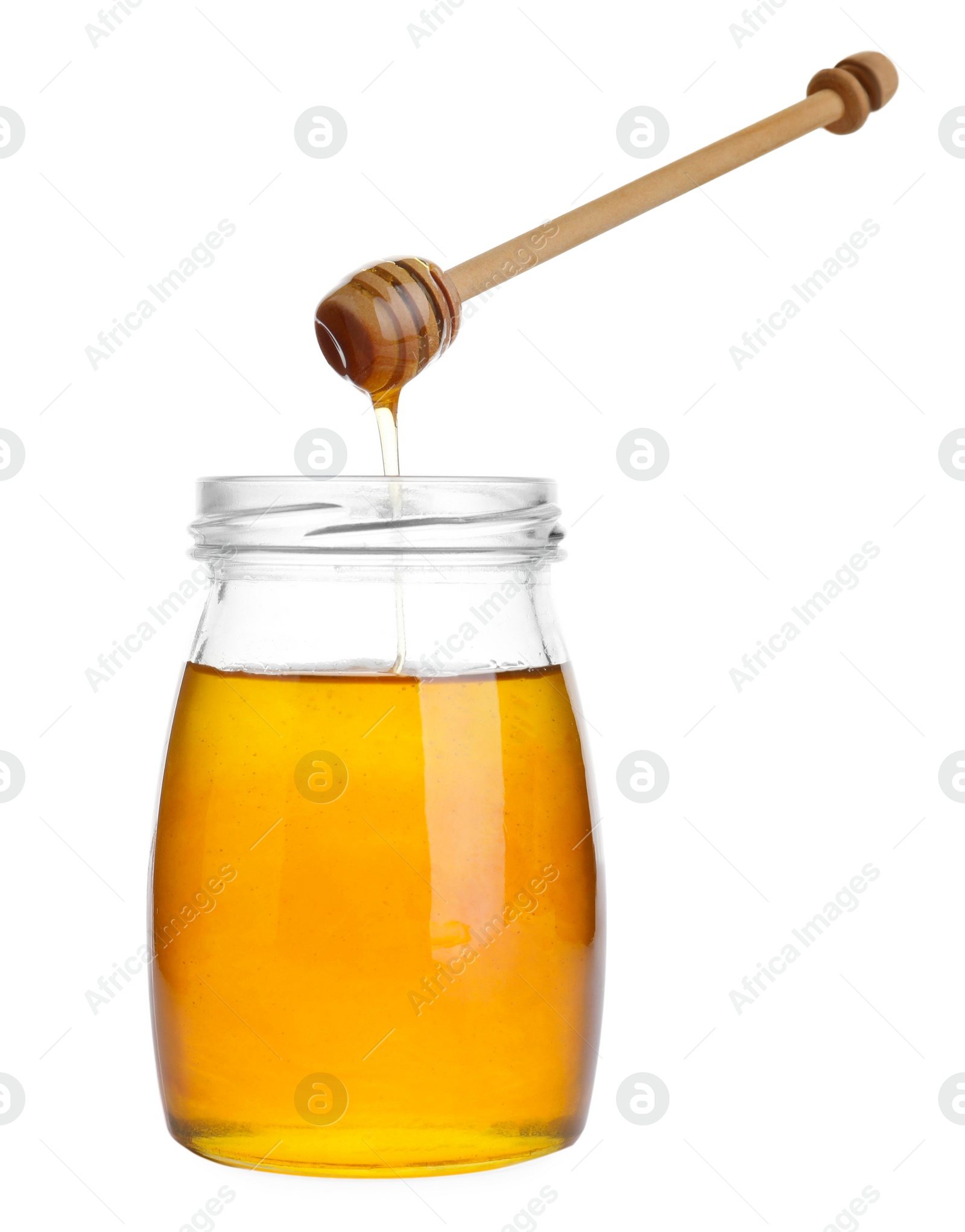 Photo of Glass jar of sunflower honey and wooden dipper isolated on white