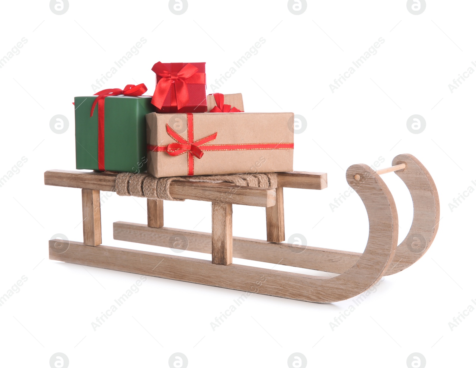 Photo of Sleigh with Christmas gifts on white background