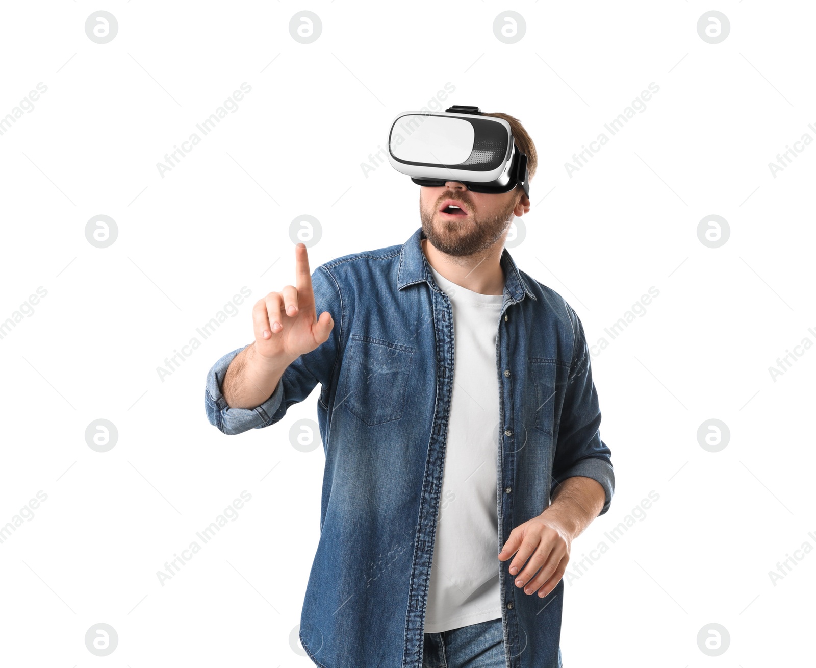 Photo of Emotional man using virtual reality headset on white background