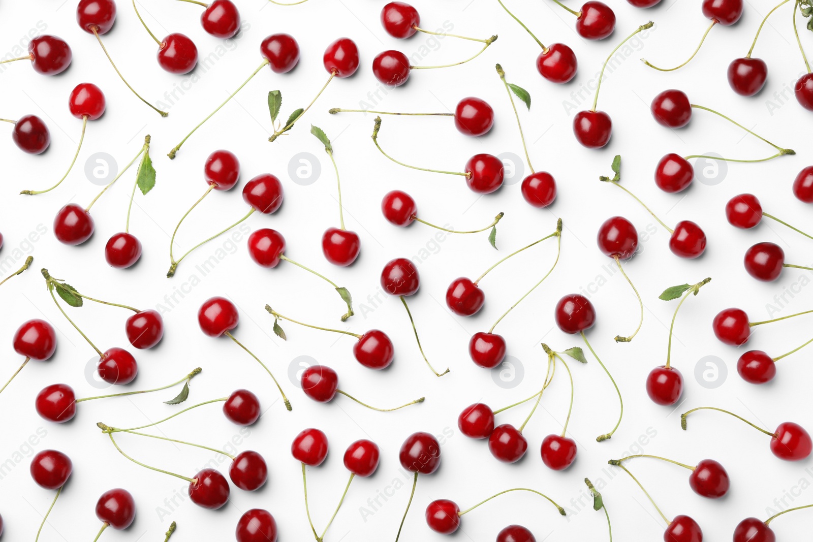 Photo of Tasty ripe cherries with leaves on white background, top view