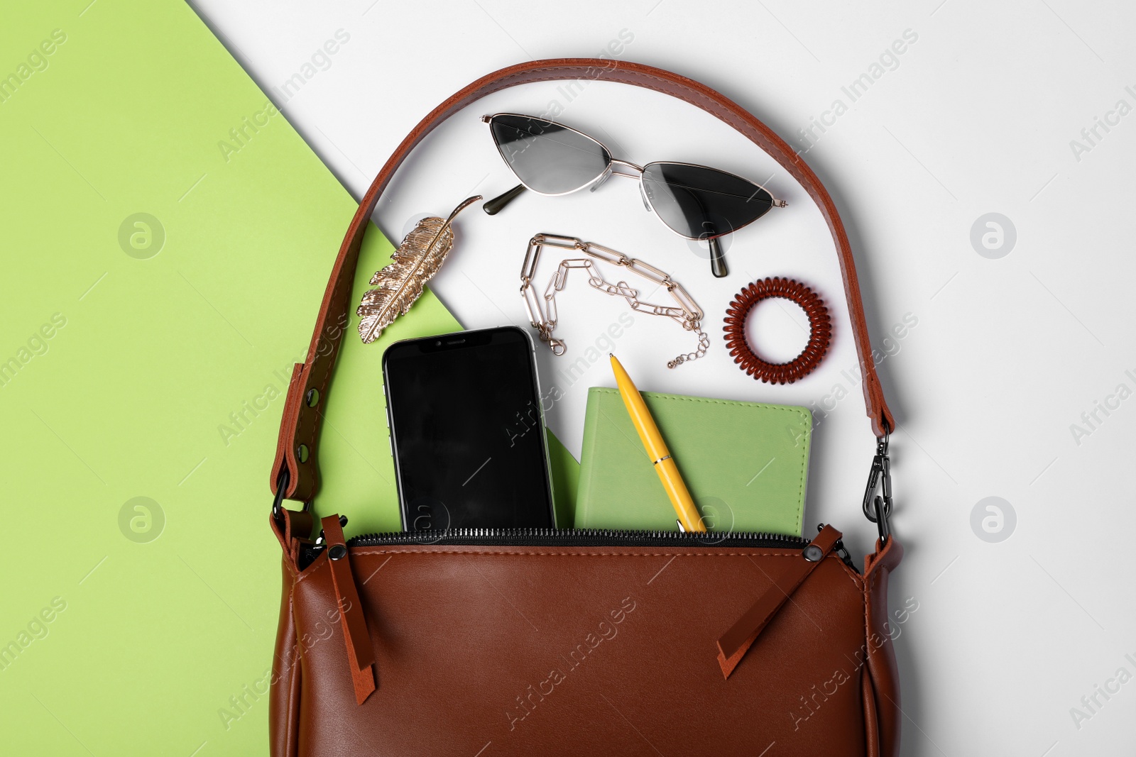 Photo of Flat lay composition with stylish woman's bag on color background