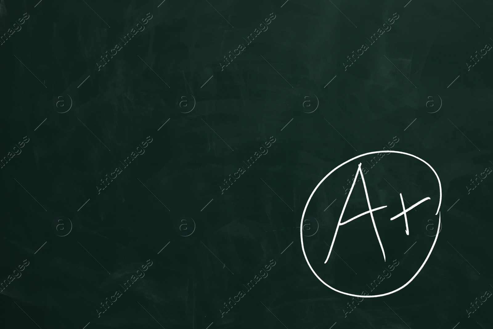 Image of School grade. Letter A with plus symbol on green chalkboard