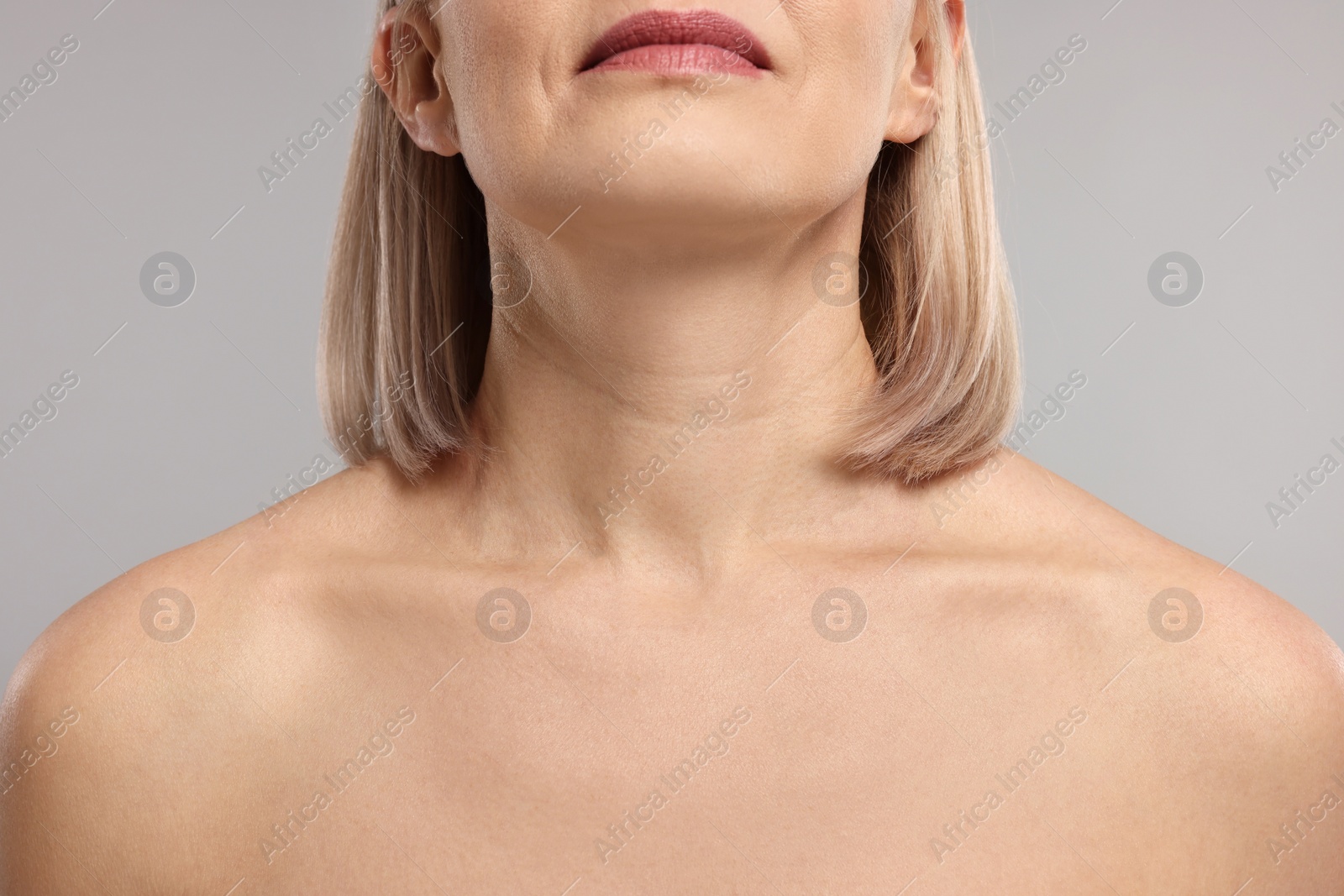 Photo of Woman with healthy skin on grey background, closeup