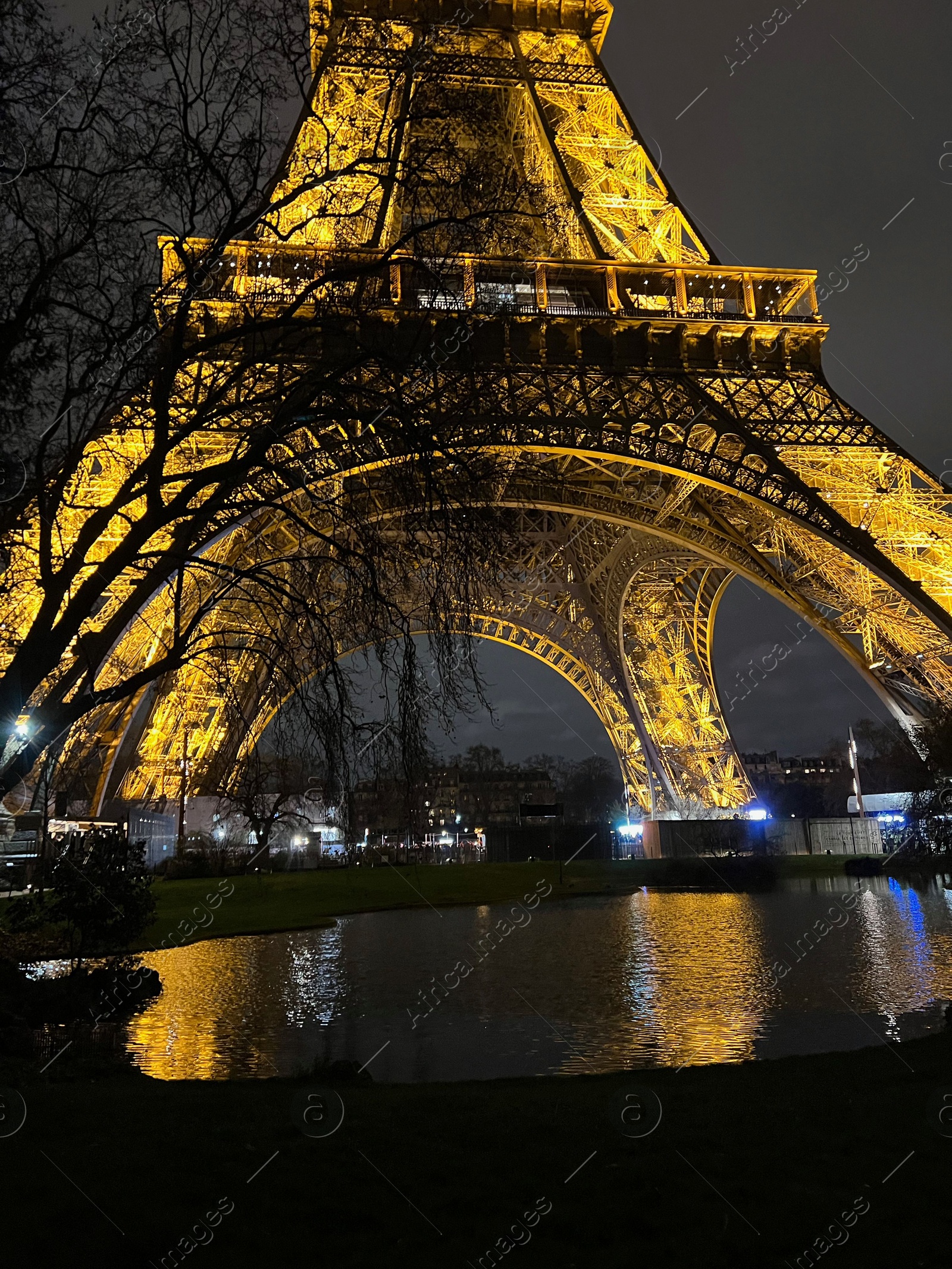 Photo of Beautiful illuminated Eiffel tower against night sky, low angle view