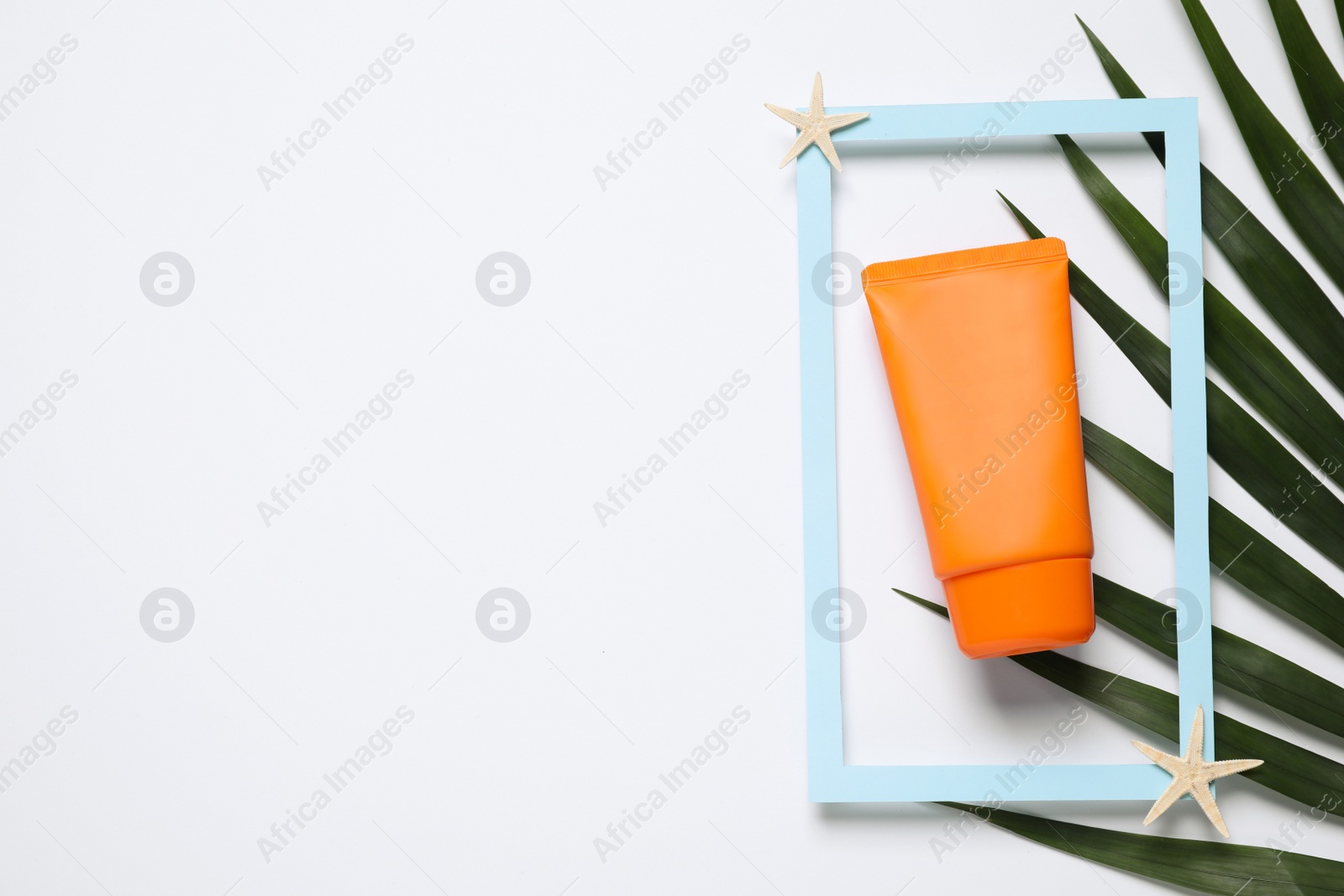 Photo of Composition with sun protection product on white background, top view. Space for text