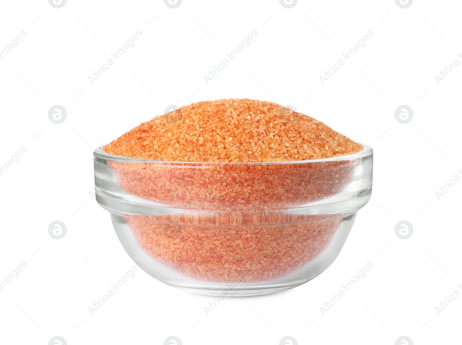 Photo of Orange salt in glass bowl isolated on white