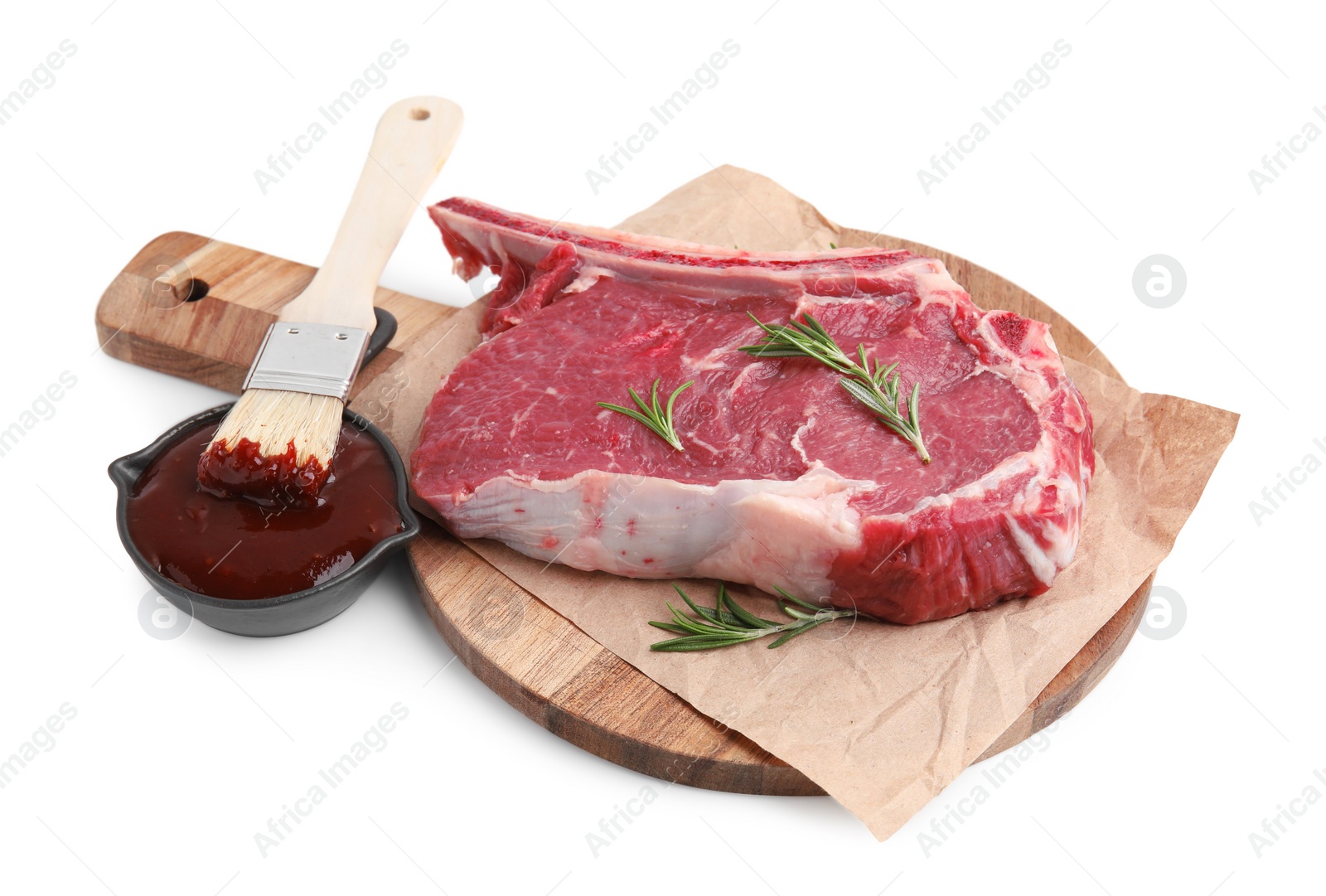 Photo of Board with raw meat, rosemary and marinade isolated on white