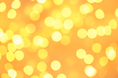 Photo of Beautiful golden lights as background. Bokeh effect