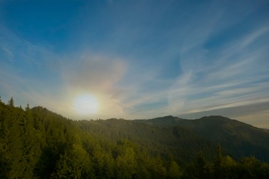 Image of Aerial view of beautiful mountain landscape with green trees in morning