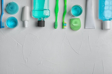 Flat lay composition with oral care products and space for text on light background. Teeth hygiene